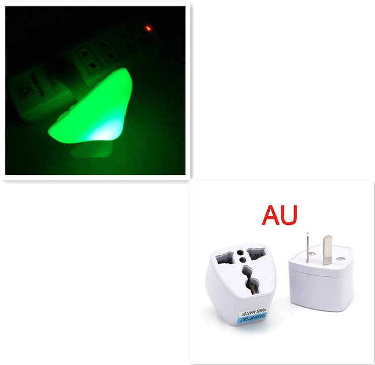 Two travel adapters with a green mushroom shaped night light and 'AU' label on a white background.