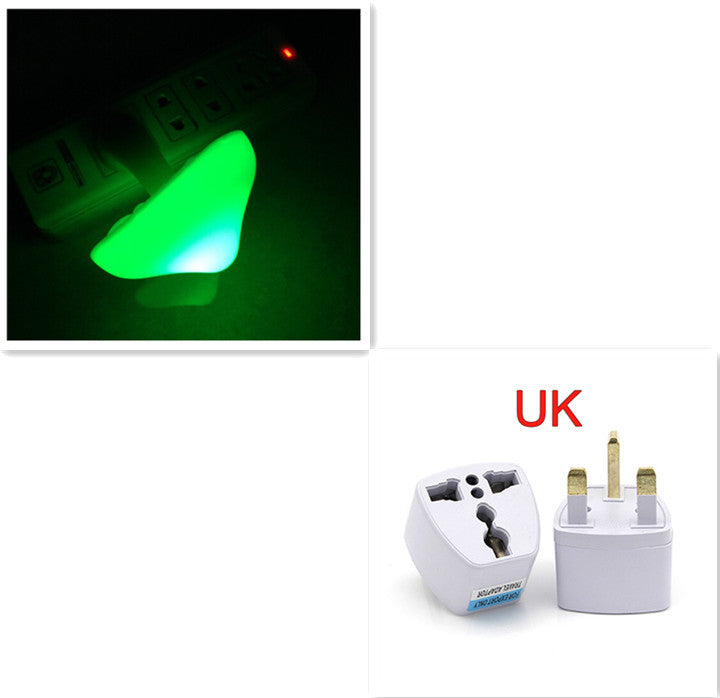 Travel adapter with green mushroom shaped night light and UK plug design on a white background