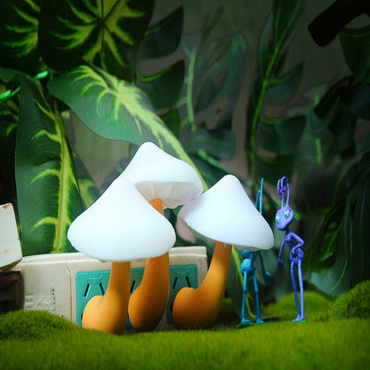 Two cartoon-style mushrooms with a blue character in a forest setting