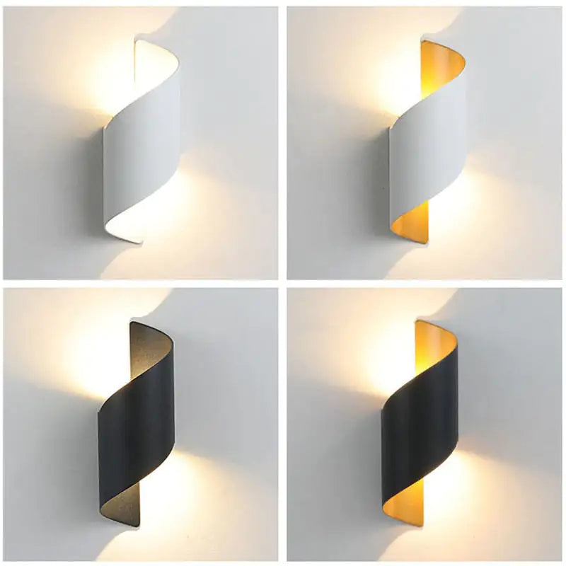 Wall-mounted light fixture in black and gold on a white background