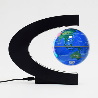 blue levitating globe with black base and white background