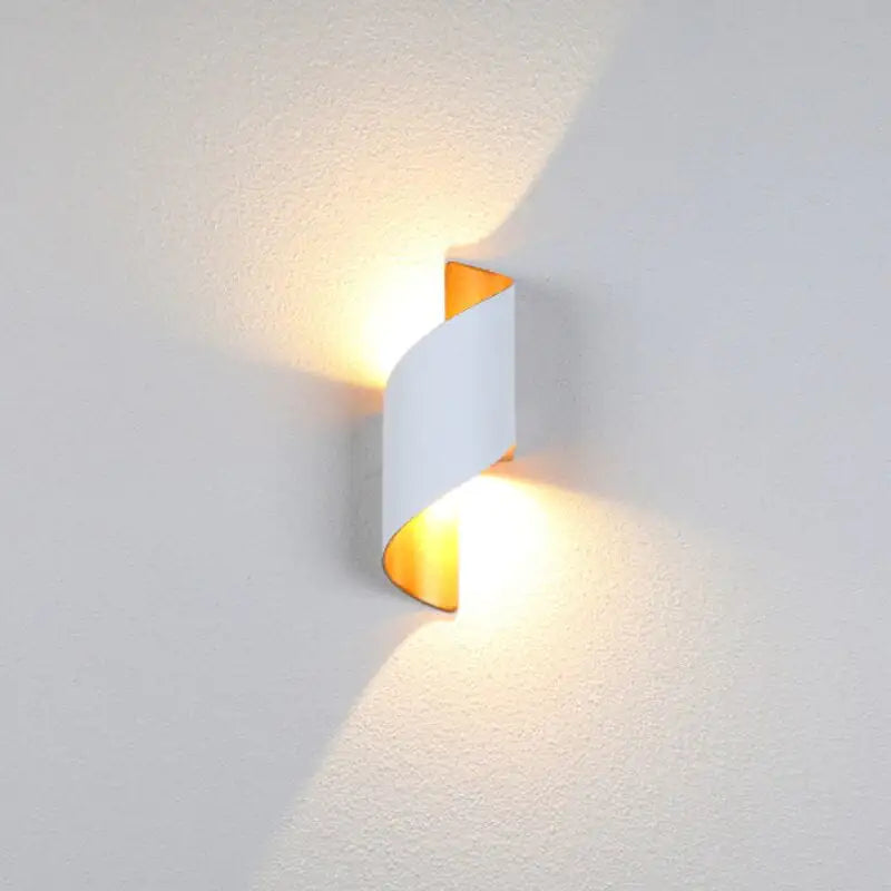 Modern wall light fixture on a textured white wall