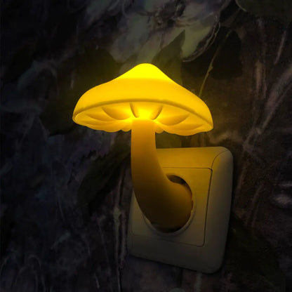 Mushroom-shaped night light attached to a wall socket with a dark floral background.