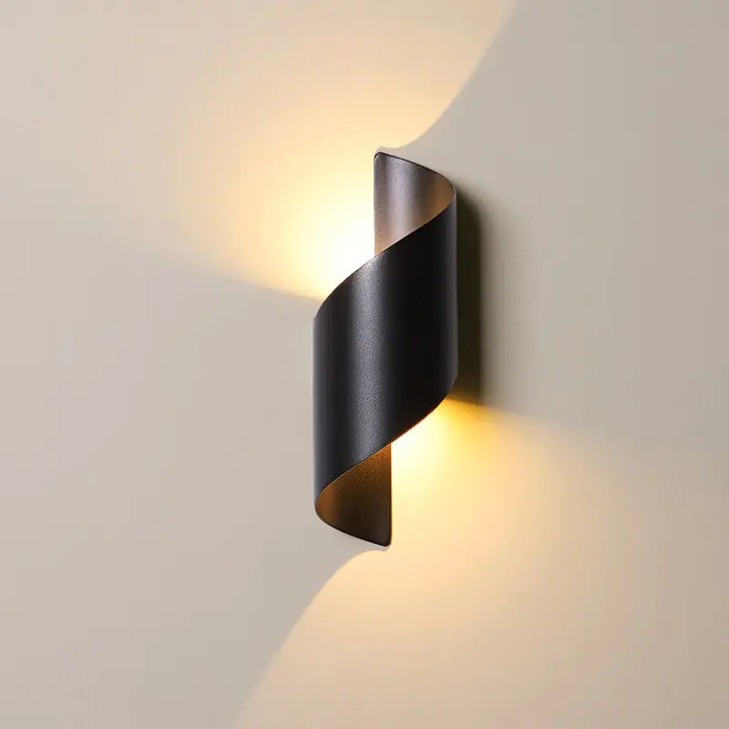 Modern wall-mounted light fixture on a neutral wall
